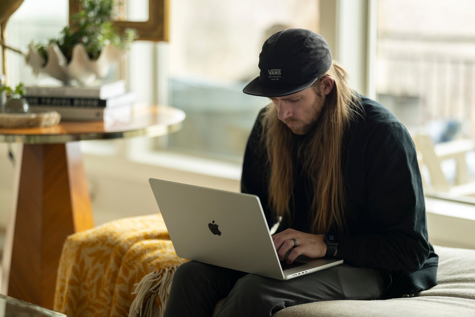 Justin Woods working on a laptop